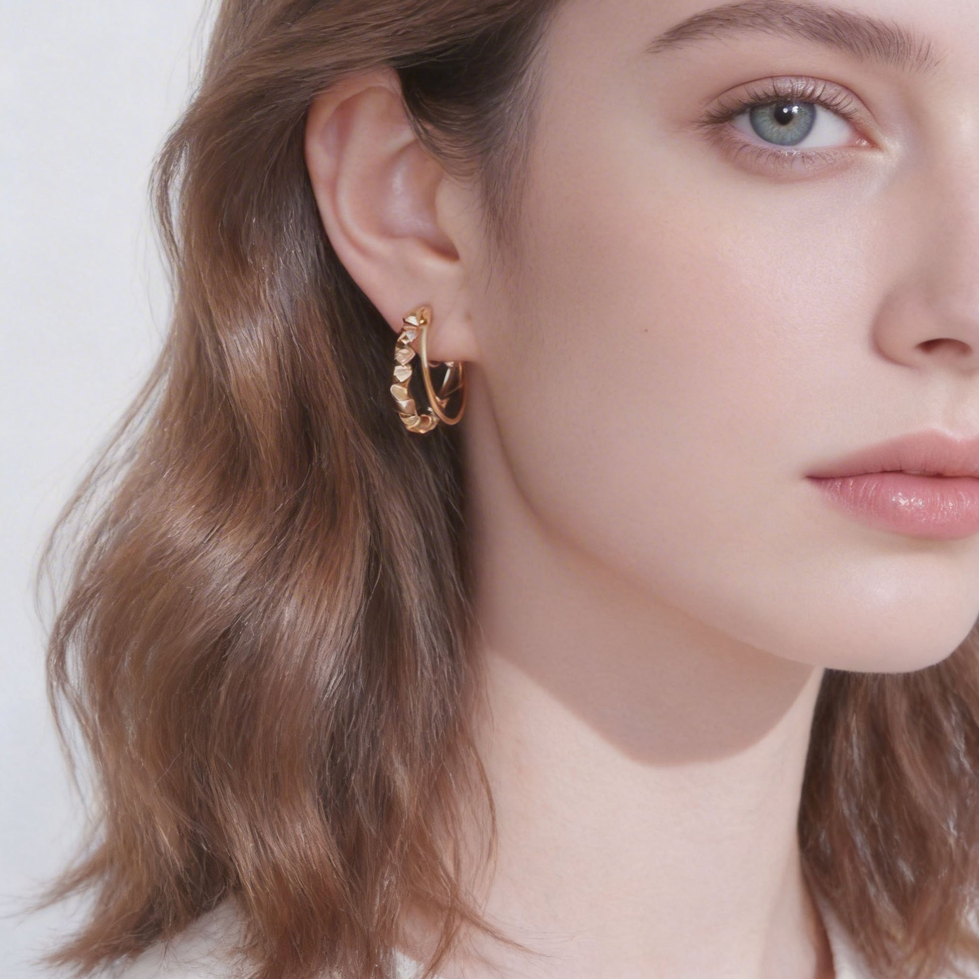 Polished Knotted Clip-On Hoop Earrings in gold and silver by SOMIY for non-pierced ears.