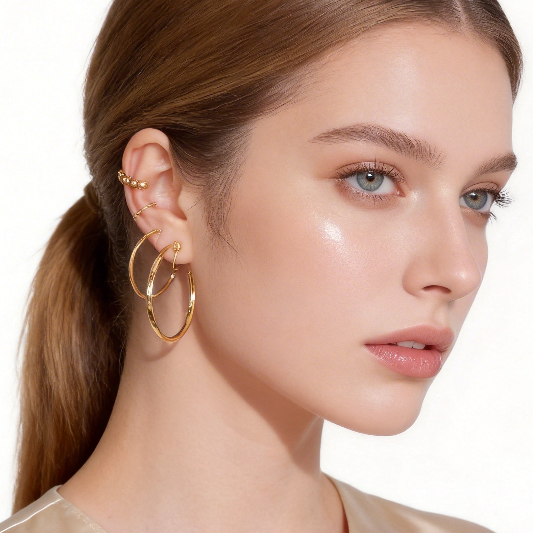 Large Sleek Polished Clip-On Hoop Earrings in 18K gold and silver by SOMIY for non-pierced ears.