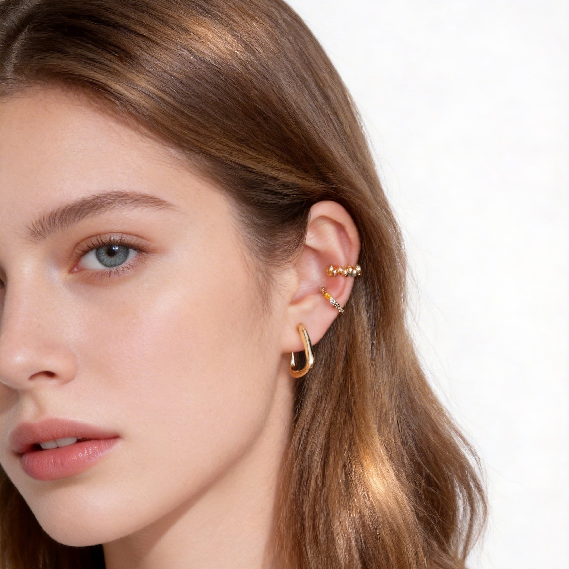 Polished Ribbed Clip-On Hoop Earrings in 18K gold plating by SOMIY for non-pierced ears.