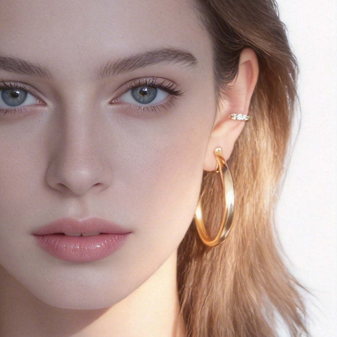 Large Polished Rounded Clip-On Hoop Earrings in gold and silver by SOMIY for non-pierced ears.