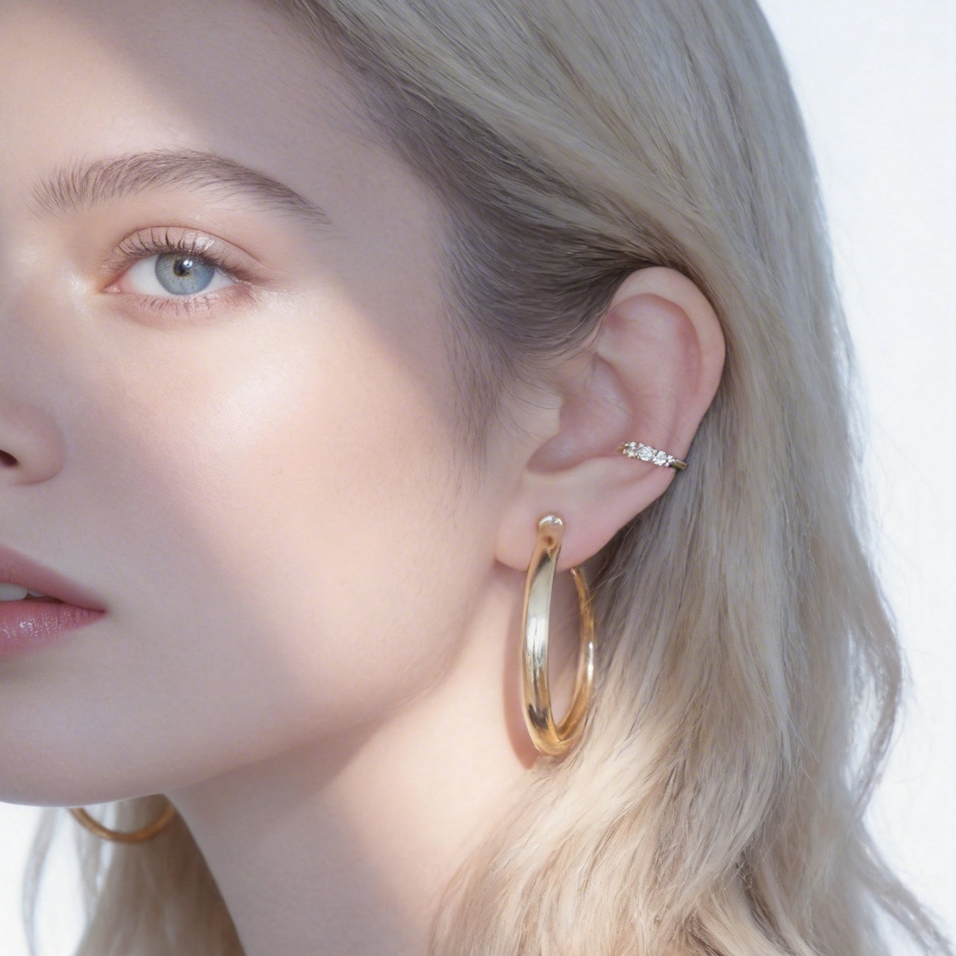 Large Polished Rounded Clip-On Hoop Earrings in gold and silver by SOMIY for non-pierced ears.