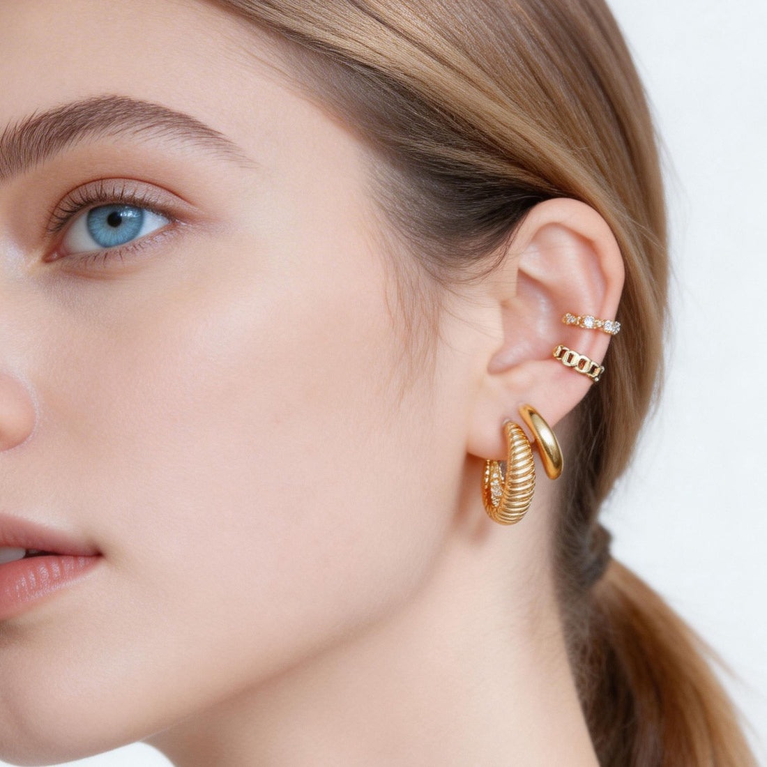 Essential Polished Medium Clip-On Hoop Earrings in 18K gold and silver by SOMIY for non-pierced ears.