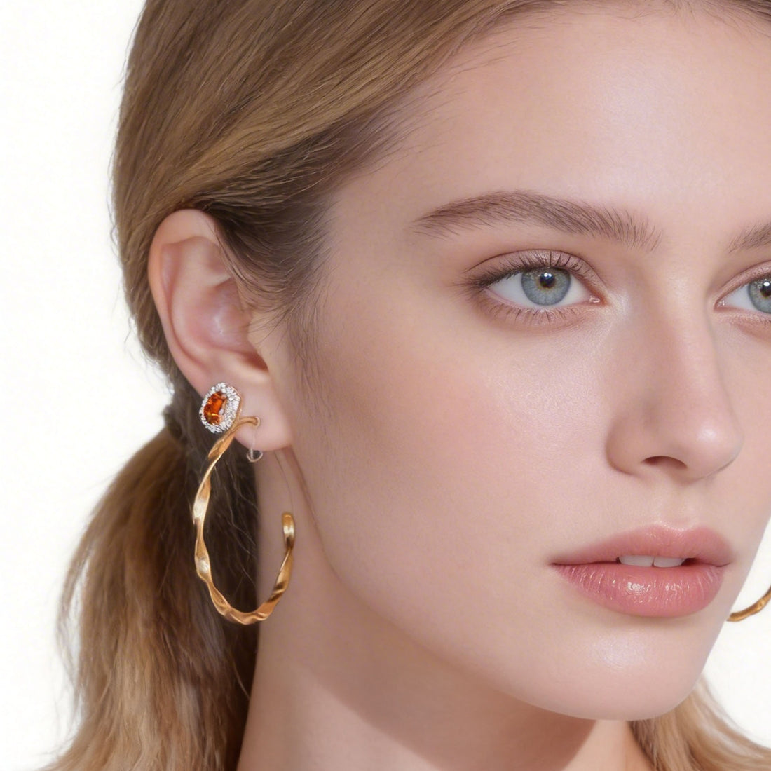 Red cushion halo clip-on studs in gold settings with spiral disc backs