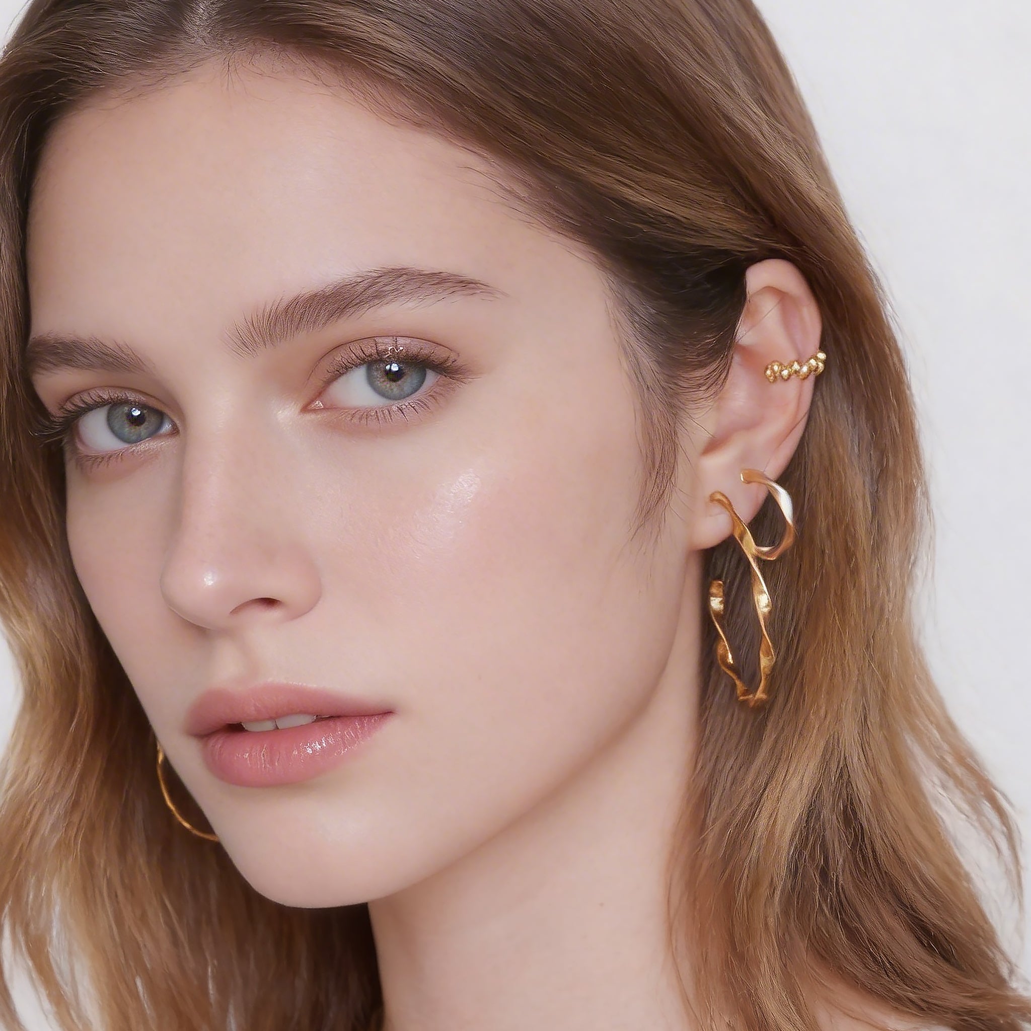 Sleek Linear Ridged Clip-On Hoop Earrings in 18K gold and silver by SOMIY for non-pierced ears.