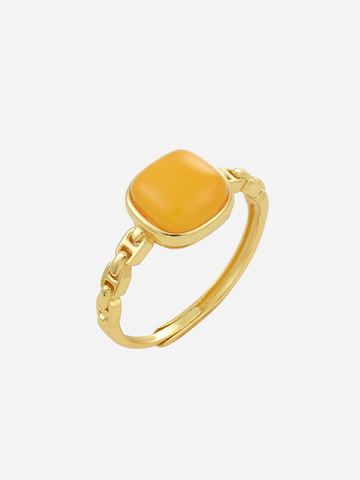 Linked Heritage butterscotch amber ring with a cushion stone and chain-style gold band