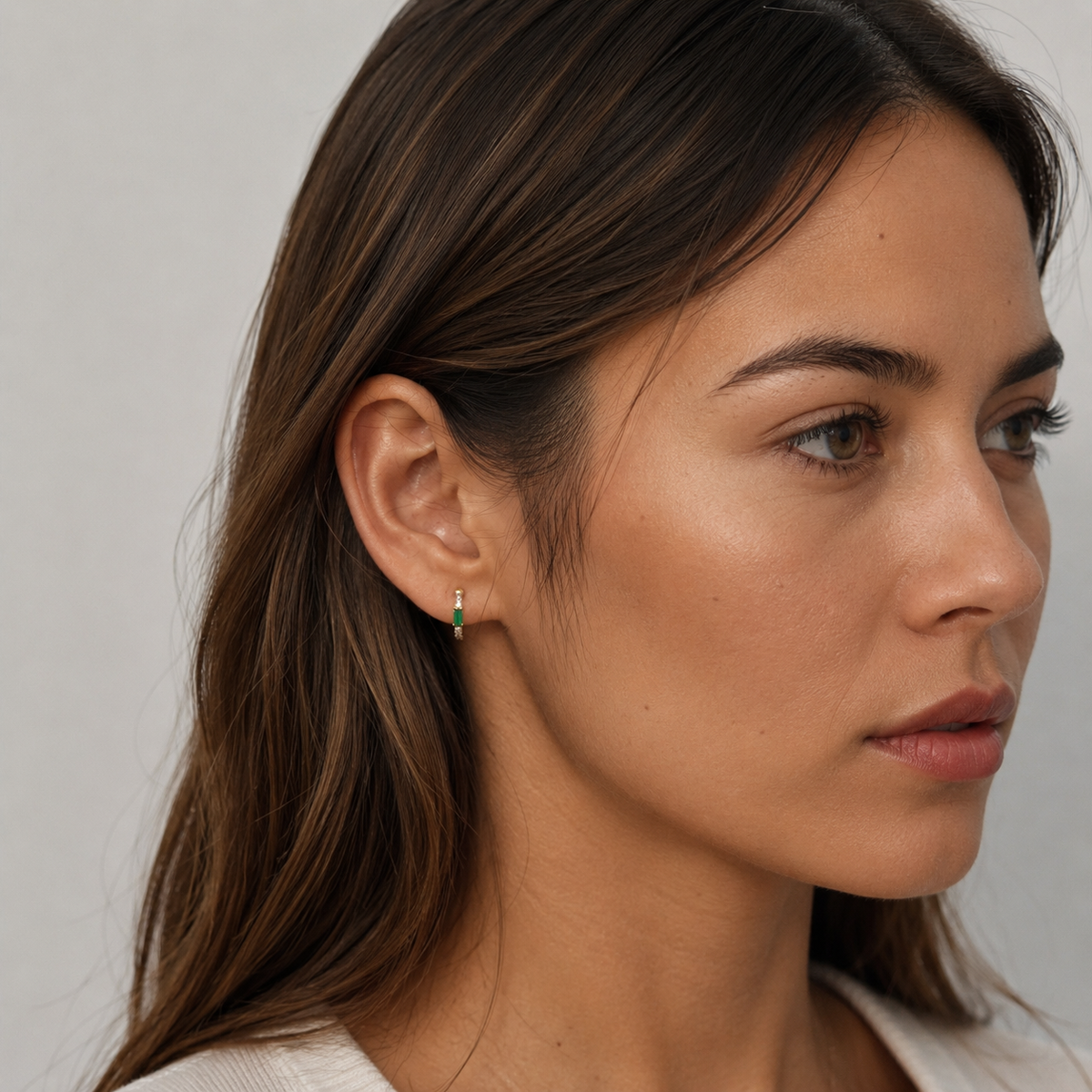 Model wearing SOMIY Green Gemstone Clip-On Hoop Earrings in gold