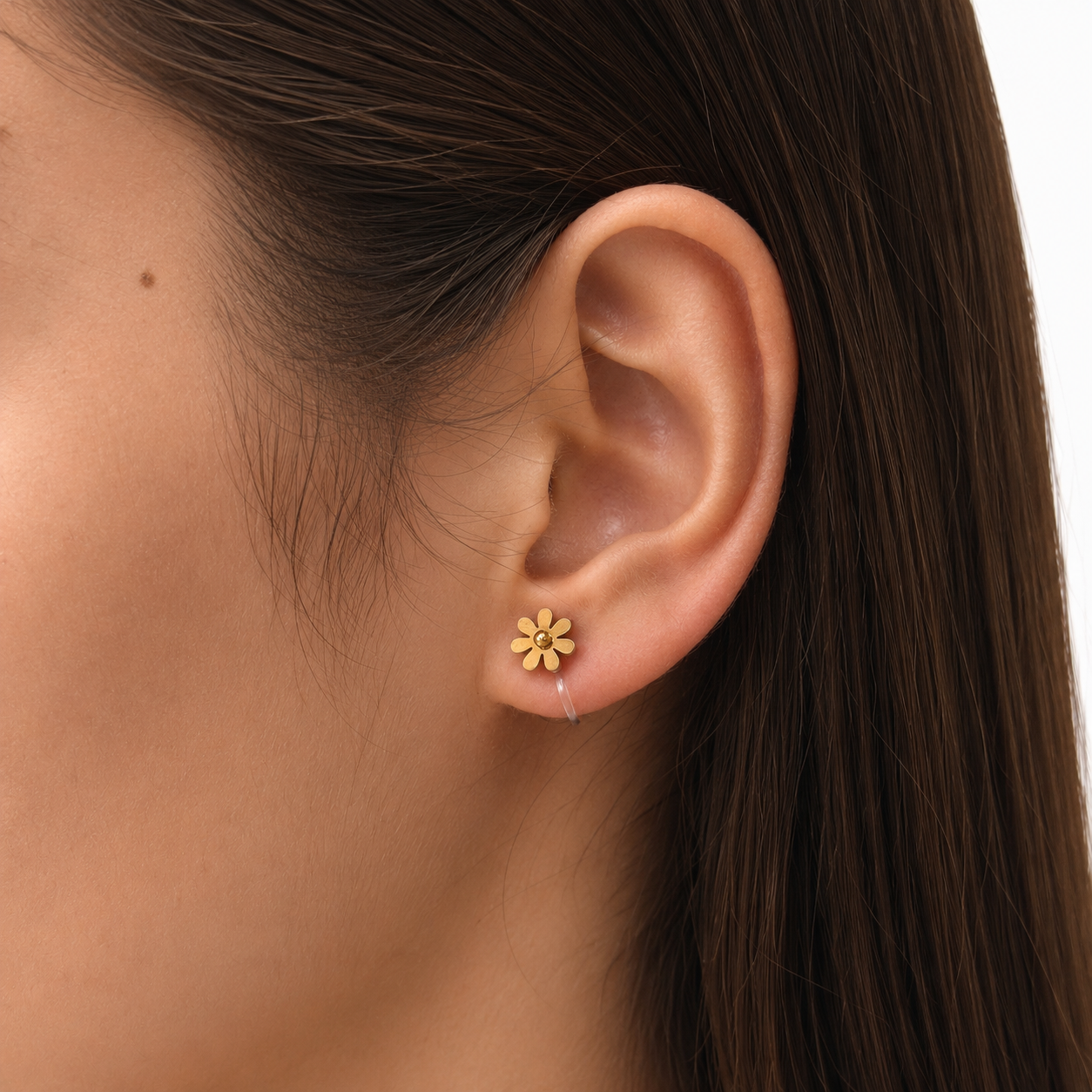 Model wearing Daisy Clip-On Stud Earrings in gold close-up view