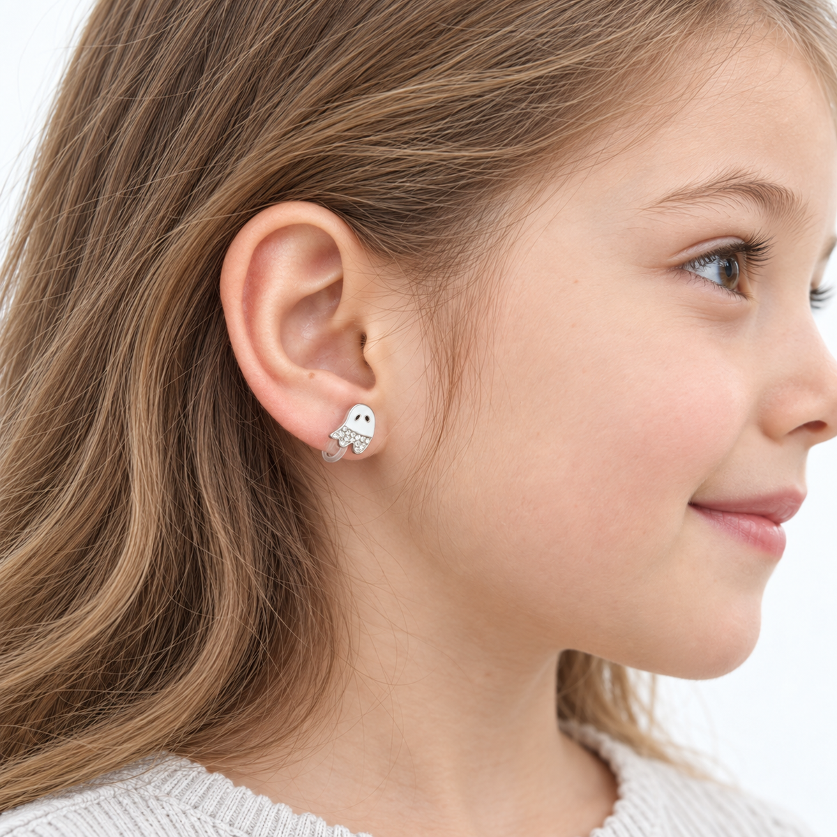 Sparkling Little Ghost Clip-On Earrings for Girls, worn on the ear, close-up