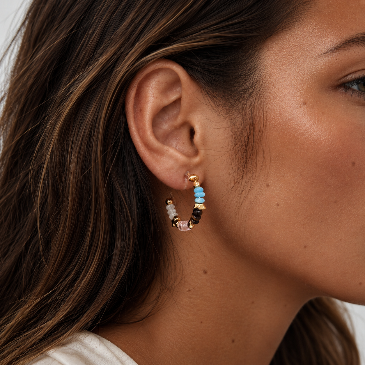 Multicolor Crystal Beaded Clip-On Hoop Earrings in Gold worn on model close-up