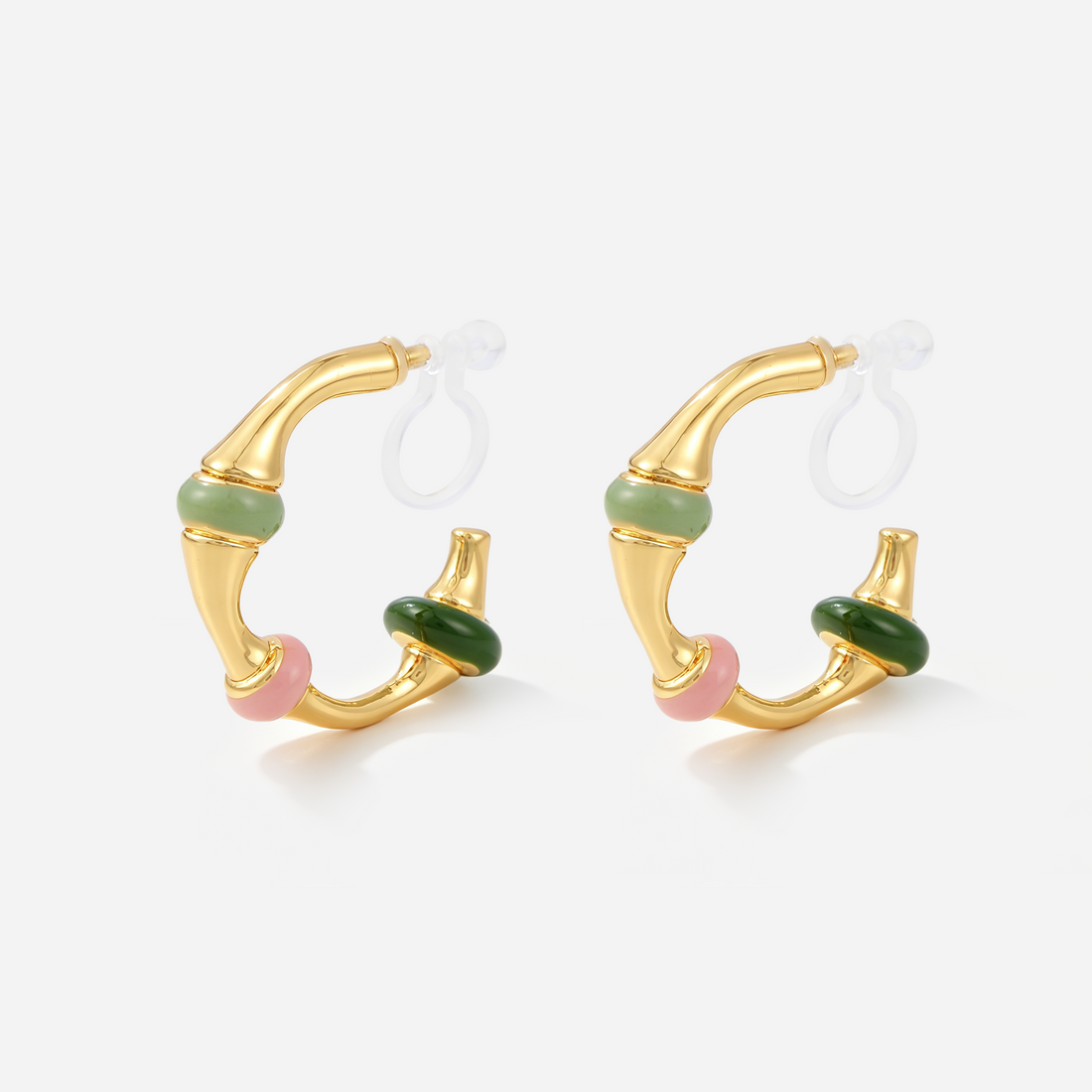 Gold clip-on hoop earrings with pastel green, pink and dark green enamel bands and invisible resin clips