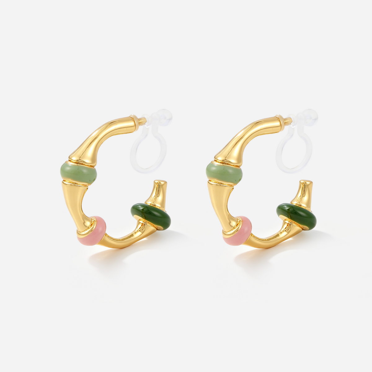 Gold clip-on hoop earrings with pastel green, pink and dark green enamel bands and invisible resin clips