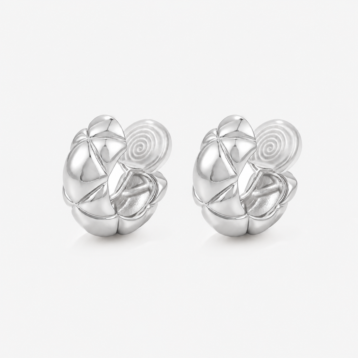 Silver quilted dome clip-on hoop earrings with sculpted rounded sections and cushioned coil backs