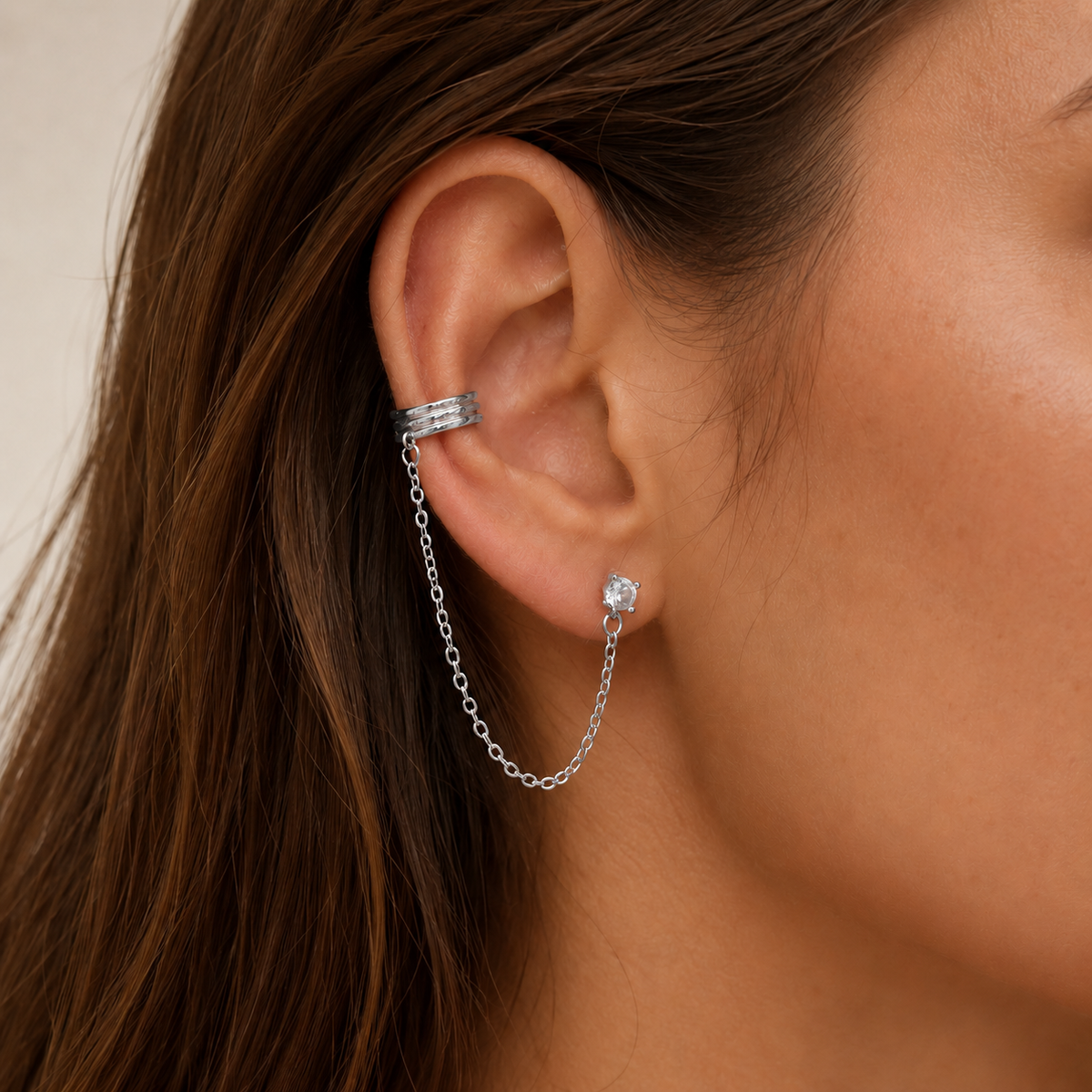 Close-up of SOMIY CZ Chain Ear Cuffs with Clip-On Studs in silver worn on the ear