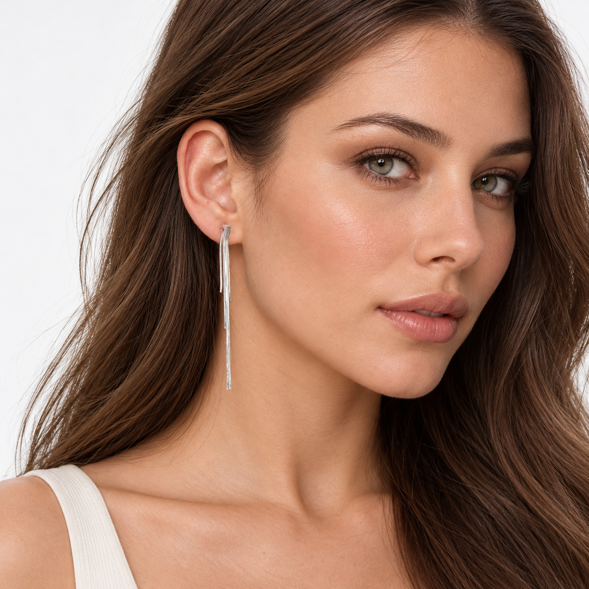 Model wearing SOMIY Layered Chain Tassel Clip-On Dangle Earrings in silver