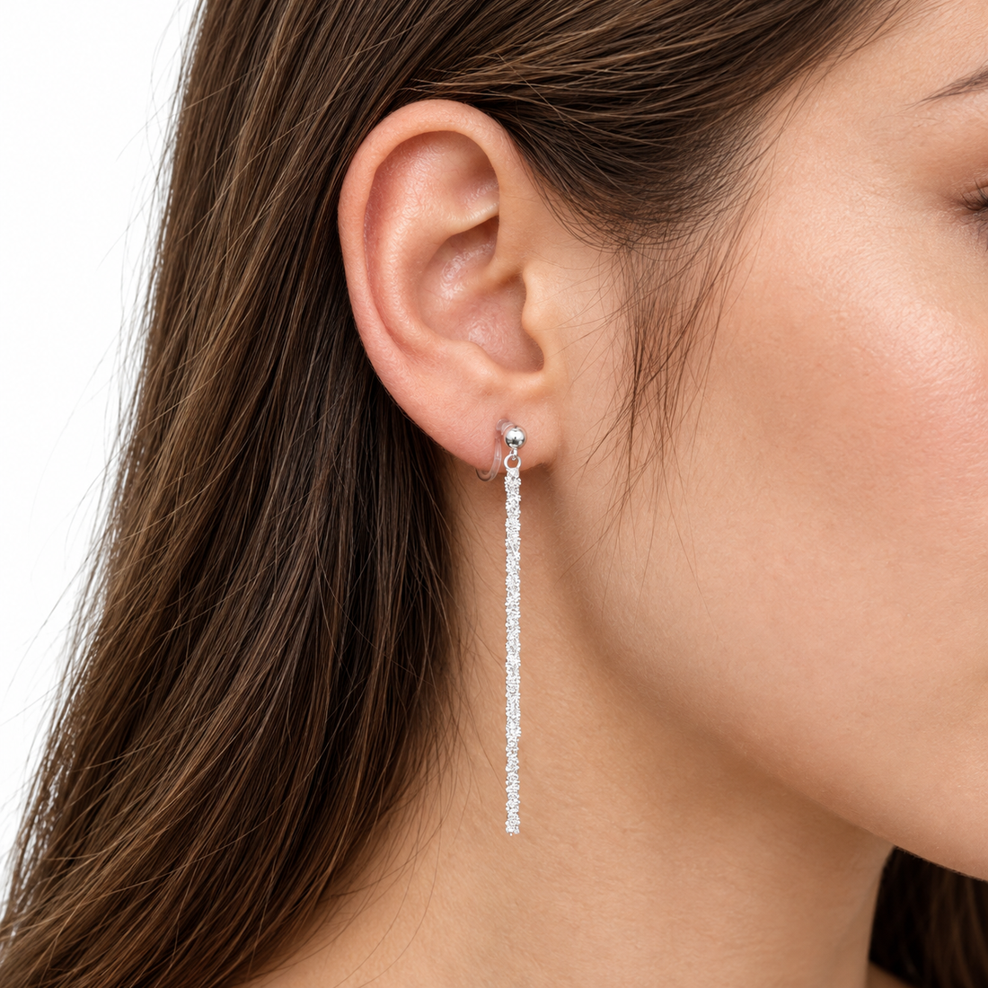 Angled view of SOMIY Round Top Chain Tassel Clip-On Dangle Earrings in silver, showing the clear resin clips