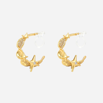 Gold Starlight Twist clip-on hoop earrings with four-point stars, zircon accents and invisible resin clips