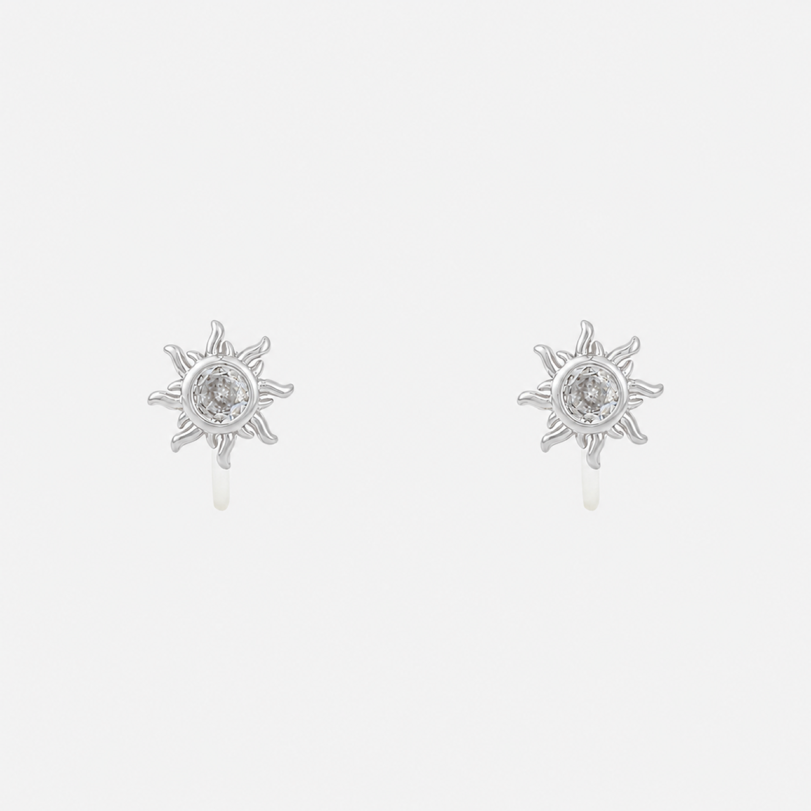 Silver sunburst crystal clip-on stud earrings with invisible resin clips | SOMIY